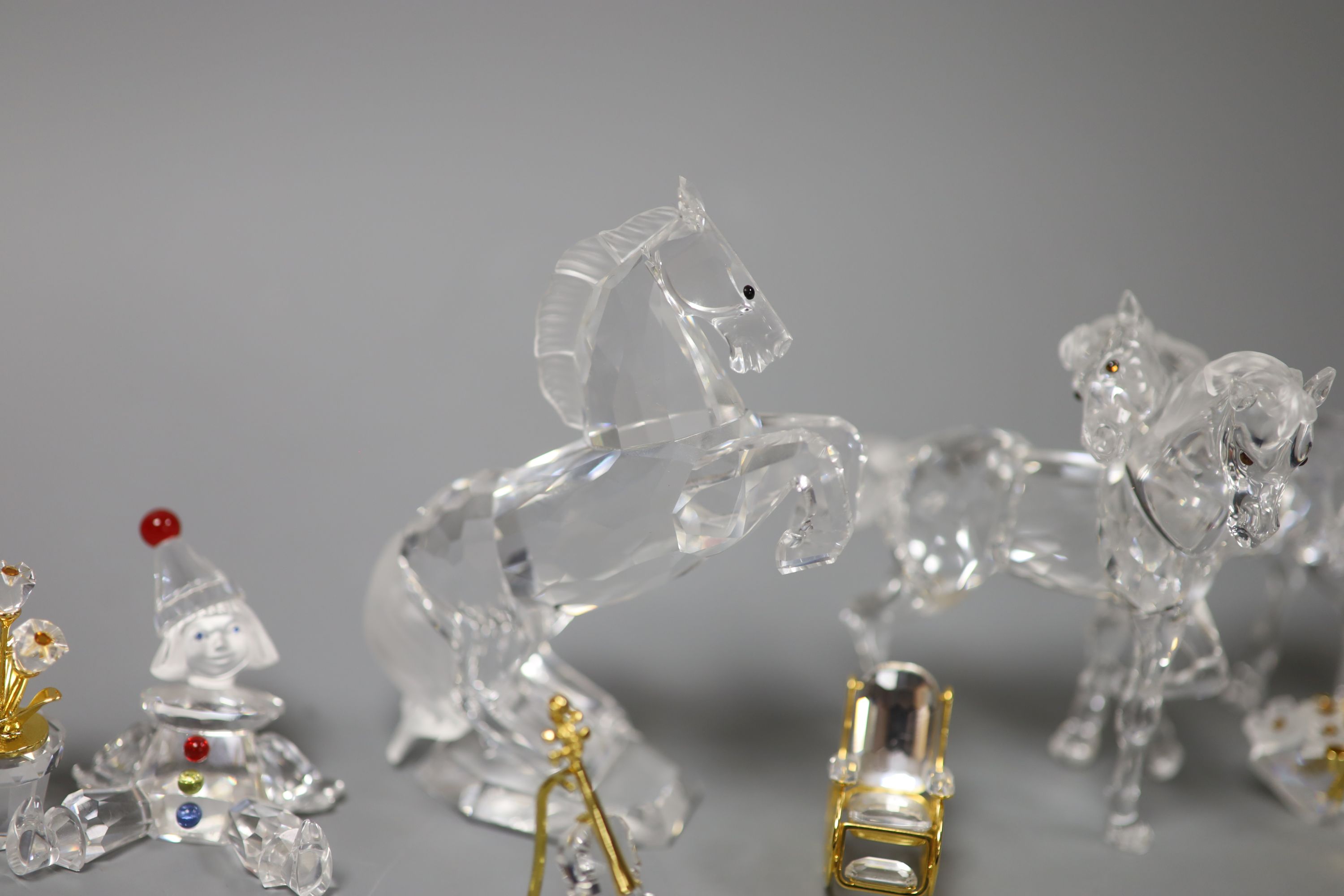 Thirteen Swarovski crystals including Pair of Horses and Seated Clown